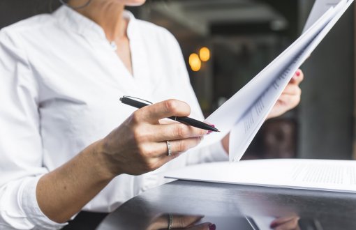 close-up-of-a-woman-examining-document.jpg